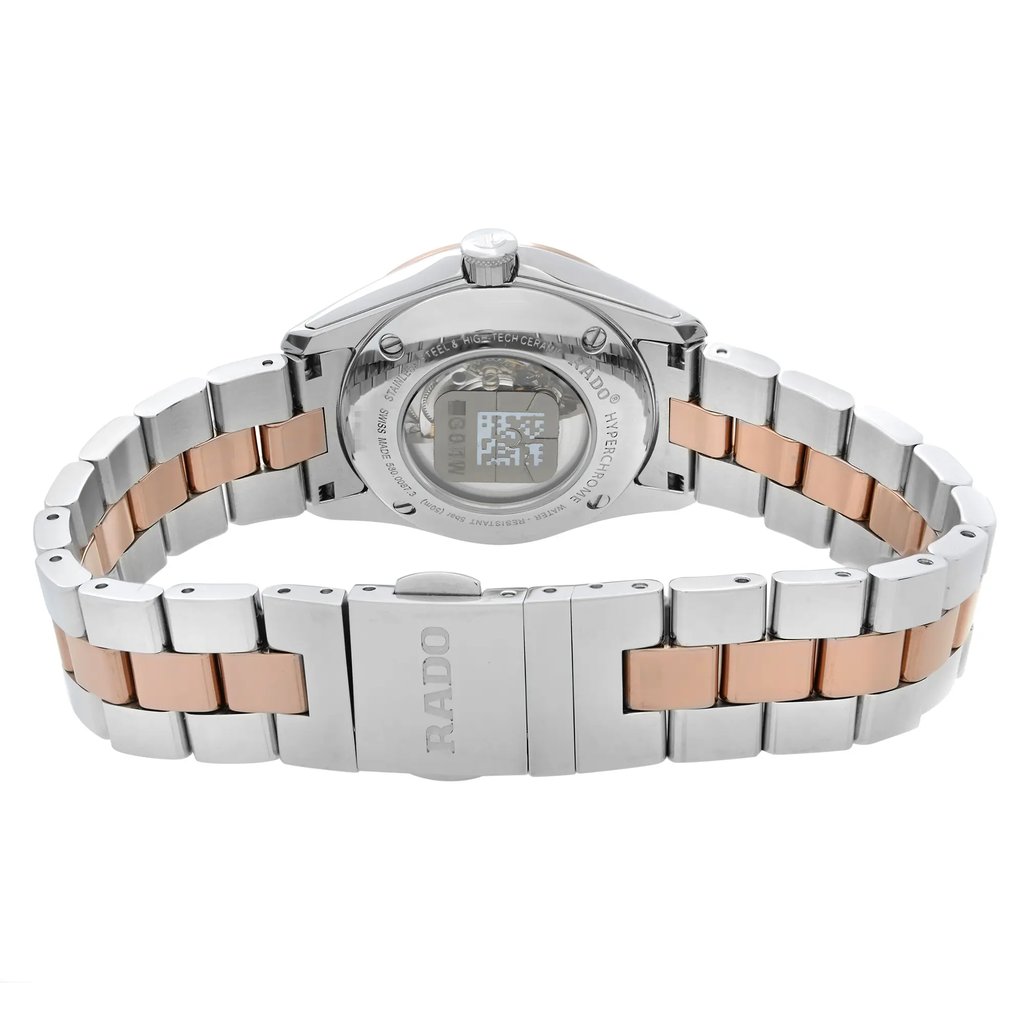 An image of a wristwatch showcasing the back view with a focus on the closed clasp. The watch features a two-tone metal bracelet, combining silver and rose gold links. The angle is straight-on from the back, and the image is taken at a close distance to highlight the details of the clasp and the watch's back. The watch is a display model, indicated by the visible label on the back.