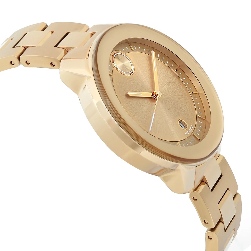 An image of a pre-owned wristwatch captured from a side profile view, opposite the crown. The watch features a gold-toned case and bracelet, with a minimalist dial design. The angle highlights the watch's sleek, polished finish and the bracelet's linked structure, showcasing its elegant appearance. The photo is taken at a close distance to emphasize the watch's details and craftsmanship.