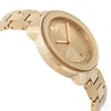 An image of a pre-owned wristwatch captured from a side profile view, opposite the crown. The watch features a gold-toned case and bracelet, with a minimalist dial design. The angle highlights the watch's sleek, polished finish and the bracelet's linked structure, showcasing its elegant appearance. The photo is taken at a close distance to emphasize the watch's details and craftsmanship.