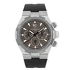 An image of a pre-owned Vacheron Constantin Overseas 42MM Steel Grey Dial Automatic men's wristwatch, captured from a front-facing angle at a close distance. The watch features a silver case with a black rubber strap. It includes a date indicator and luminous hands, with three sub-dials on a dark face. The crown and pushers are visible on the right side.