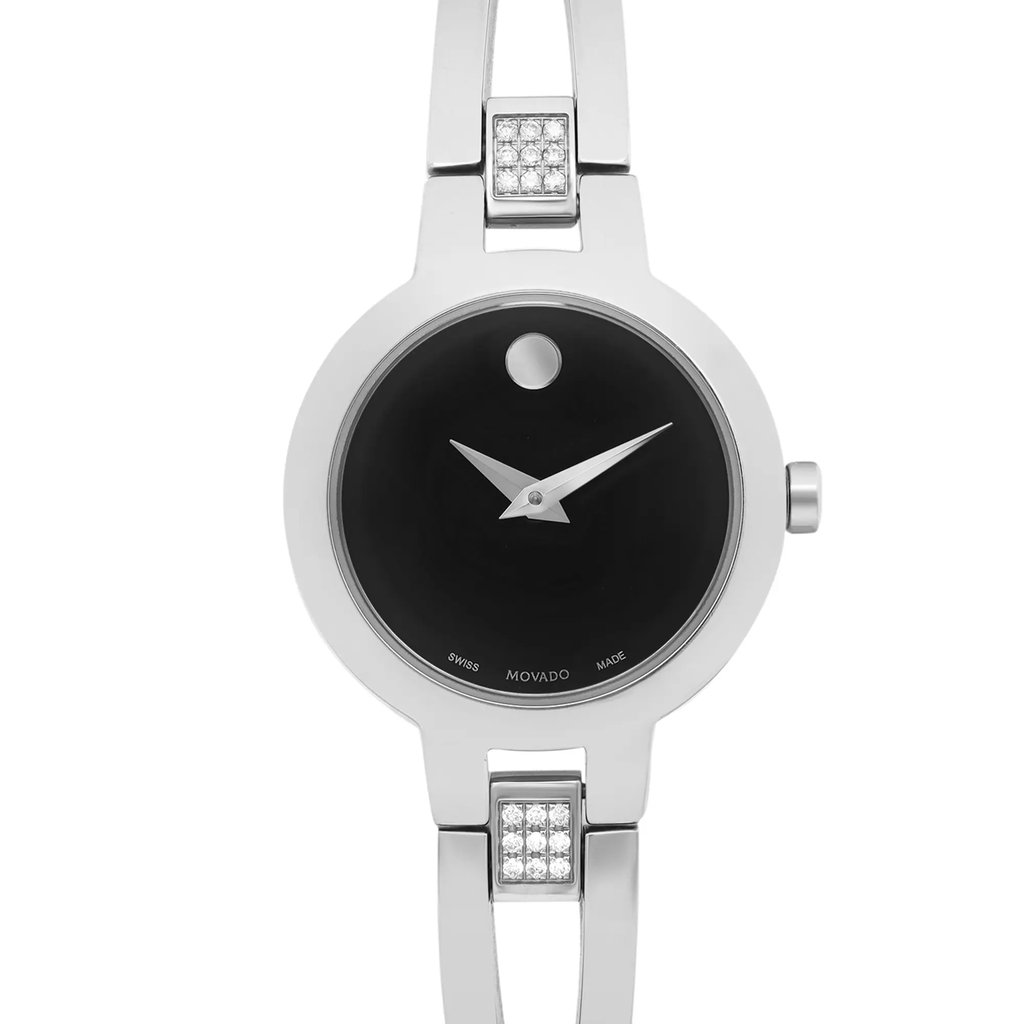An image of a Wristwatch by Movado. This Pre Owned item is designed for Women, featuring a Casual style. It has a Quartz movement and an Analog display with a Black dial color. The indices include 12-Hour Dial,No Hour Marks. The band is made of Stainless Steel and the case is made of Stainless Steel. The watch has a Round shape with a case size of 24 mm and a case thickness of 6 mm.