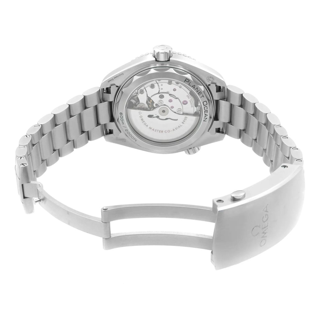An image of a wristwatch, displaying the back view with an open clasp. The watch is positioned at a slight angle, showcasing the intricate details of its mechanism through a transparent case back. The metal bracelet is partially extended, highlighting its polished links. The image is taken from a close distance, emphasizing the craftsmanship of the display model.