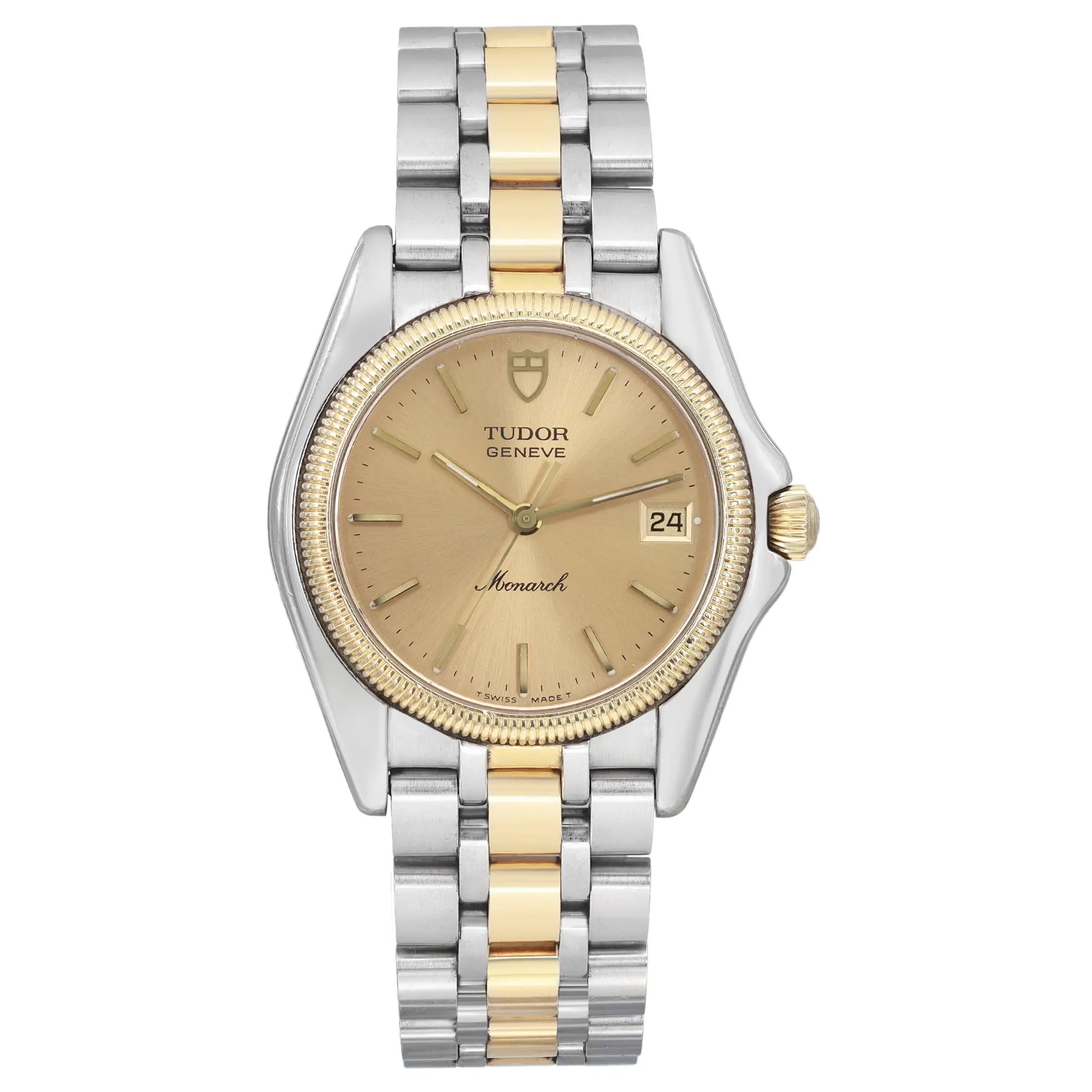 The image depicts a close-up, straight-on view of a pre-owned men's Tudor Geneve Monarch wristwatch. This watch features a two-tone metal bracelet in steel and 18k yellow gold, a gold bezel, and a champagne dial with a date indicator. The luminous hands and minimalist markers contribute to its classic design. There are minor dings on the gold bezel and scratches on the case back. Additionally, the crystal has insignificant scratches. The watch may also show minor scratches or blemishes on the case or bracelet that could have occurred during the shipping process. 
