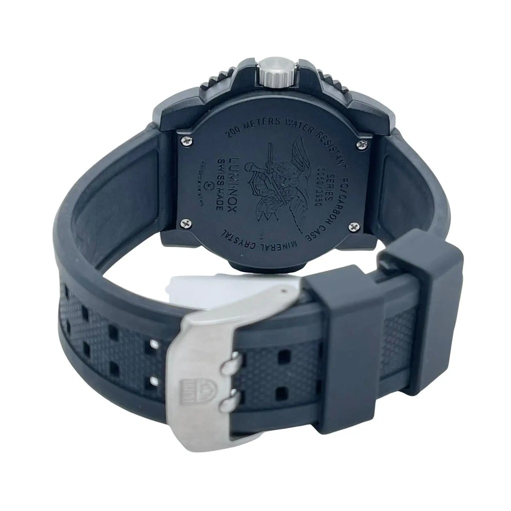 An image of a Wristwatch by Luminox. This Display Model item is designed for Men, featuring a Casual,Diver style. It has a Quartz movement and an Analog display with a Black dial color. The indices include 12-Hour Dial,Arabic Numerals,Easy to Read/Large Numerals. The band is made of Rubber and the case is made of Carbon. The watch has a Round shape with a case size of 44 mm and a case thickness of 15 mm.