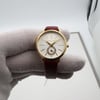 An image of a Wristwatch by Michael Kors. This Display Model item is designed for Women, featuring a Dress/Formal style. It has a Quartz movement and an Analog display with a White dial color. The indices include 12-Hour Dial,Stick Indexes. The band is made of Leather and the case is made of Stainless Steel. The watch has a Round shape with a case size of 28 mm and a case thickness of 8 mm.