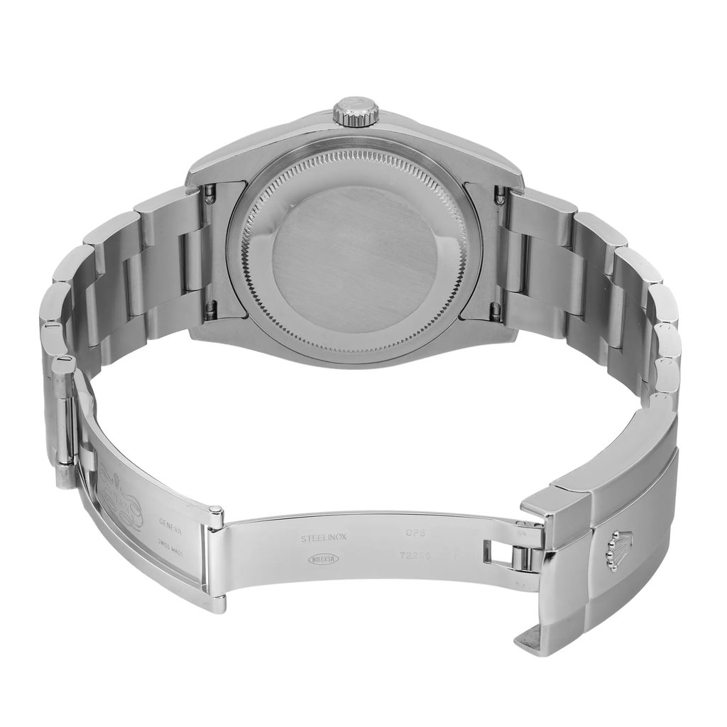 An image of a pre-owned wristwatch showing the back view with an open clasp. The watch features a metallic band and a solid case back. The angle captures the full length of the band, emphasizing the links and the clasp mechanism. The photograph is taken from a close distance, highlighting the watch's details and craftsmanship.