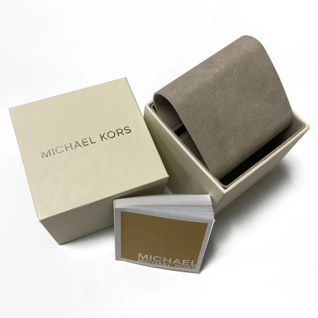 An image of a Wristwatch by Michael Kors. This New With Defects item is designed for Men, featuring a Casual style. It has a Quartz movement and an Analog display with a Blue dial color. The indices include Roman Numerals. The band is made of Stainless Steel and the case is made of Stainless Steel. The watch has a Round shape with a case size of 44 mm and a case thickness of 12 mm.