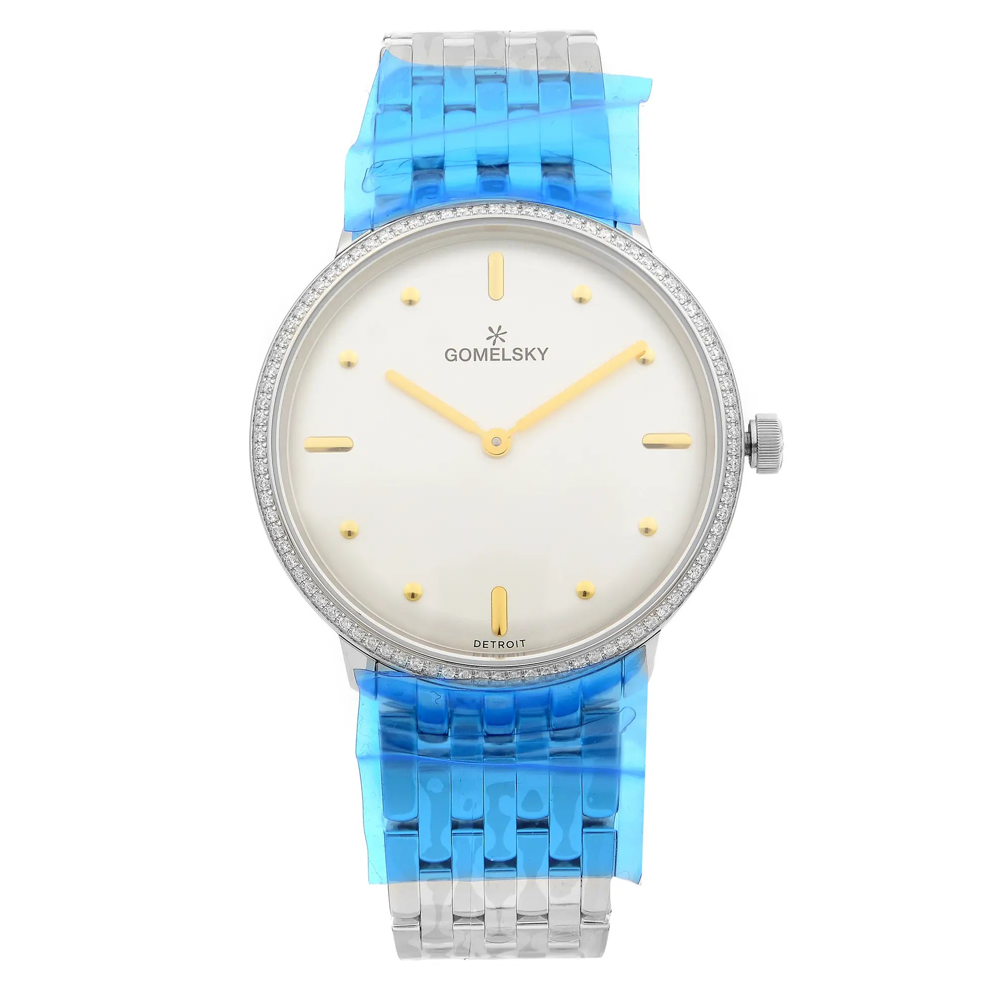 An image of a wristwatch displayed in a front full frontal view. The watch is unworn and features a sleek design with a silver case and a white dial. It has gold-tone hands and simple round hour markers. The bracelet is silver with a blue protective film. The brand name "GOMELSKY" is visible on the dial, and the watch is positioned upright, showcasing its classic and elegant style.