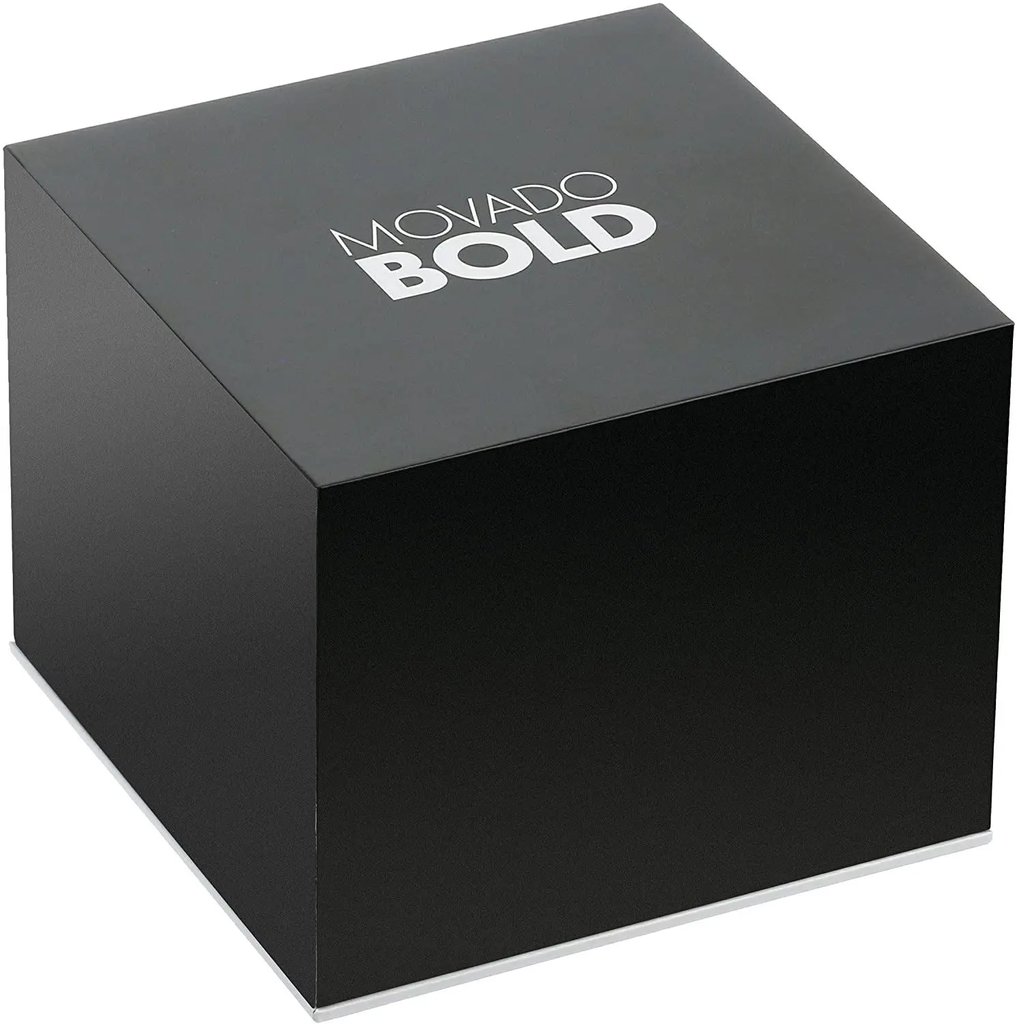 An image of a Movado Bold wristwatch box, viewed from a slightly elevated angle. The box is positioned centrally in the frame, showcasing its sleek, black exterior with the brand name prominently displayed on the top. The background is plain, emphasizing the box's new condition despite the noted defects. The image is taken at a close distance, highlighting the box's clean lines and minimalist design.