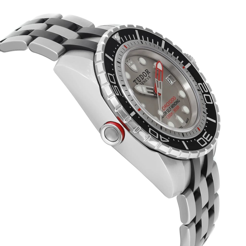An image of a wristwatch seen from a side profile view, opposite the crown. The watch features a silver and black metal bracelet. The face is round with a black bezel marked with white numerals. The dial is silver with bold hour markers and hands. The watch condition is new with defects, and it is positioned at a slight angle to highlight the design details.