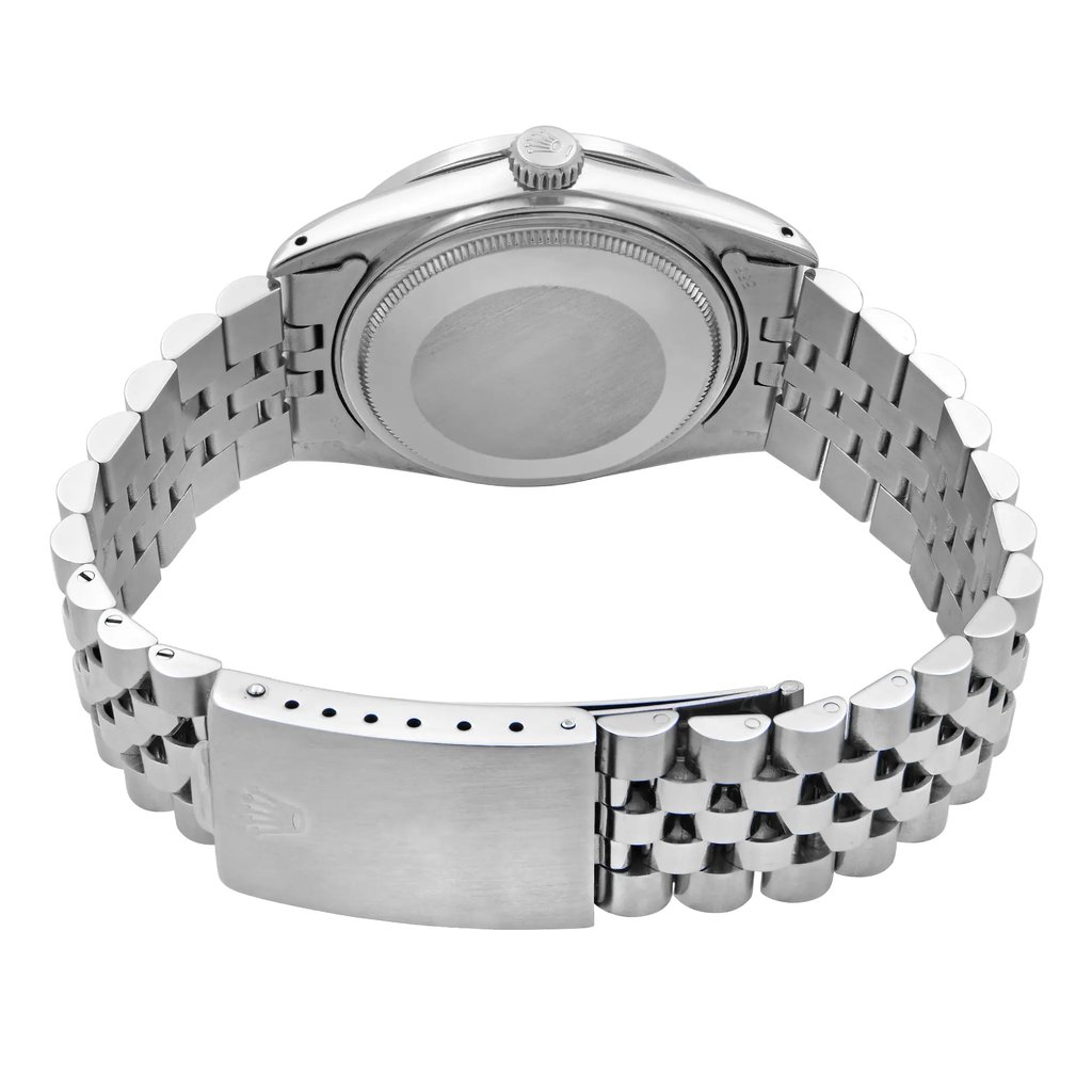 An image of a pre-owned wristwatch taken from the back view. The focus is on the closed clasp of the metal bracelet, showcasing its polished finish. The watch case back is visible, and the image is captured at a close range, highlighting the details of the link design and the smooth texture of the clasp.