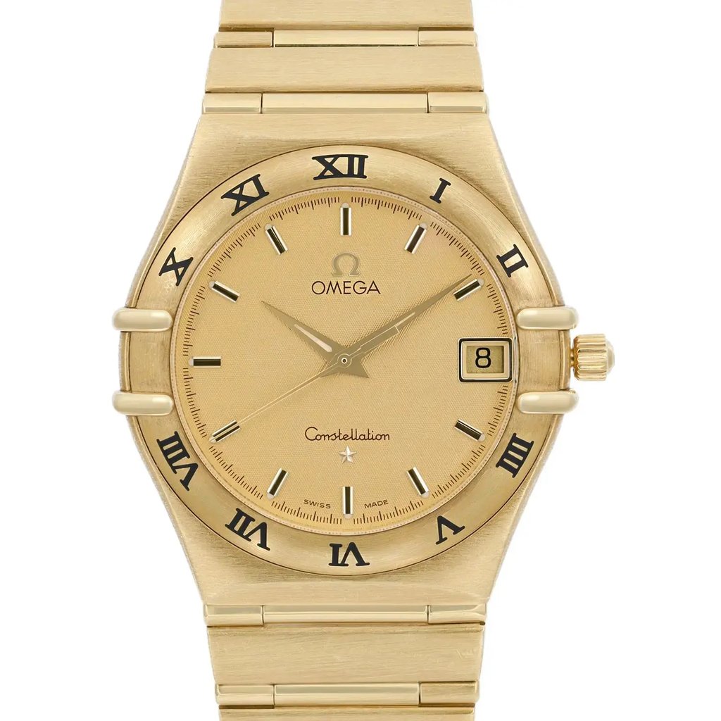 An image of a pre-owned wristwatch, shown in a front close-up shot of the watch face. The watch features a gold-toned design with Roman numerals around the bezel and a date window at the 3 o'clock position. The watch hands and indices are also gold-toned, complementing the overall aesthetic.