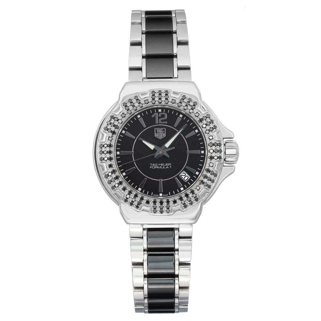 An image of a Wristwatch by TAG Heuer. This Pre Owned item is designed for Women, featuring a Dress/Formal style. It has a Quartz movement and an Analog display with a Black dial color. The indices include 12-Hour Dial,Stick Indexes. The band is made of Ceramic,Stainless Steel and the case is made of Stainless Steel. The watch has a Round shape with a case size of 36 mm and a case thickness of 10 mm.