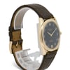 An image of a pre-owned men's Rolex wristwatch, positioned at a slight angle to the right. The watch features a dark brown leather strap and a rose gold case. The dial is black with white numerals and hands, and the Rolex logo is visible at the top. The watch is displayed at a close distance, showcasing its elegant design and craftsmanship.
