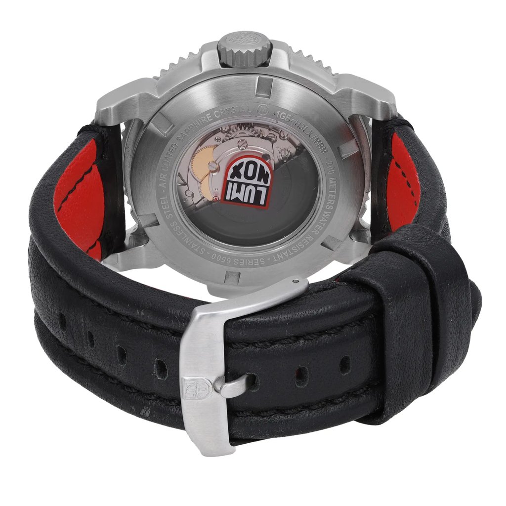 An image of a Wristwatch by Luminox. This Pre Owned item is designed for Men, featuring a Dress/Formal,Luxury style. It has a Mechanical (Automatic) movement and an Analog display with a Black dial color. The indices include 12-Hour Dial,Multiple Hands,Non-Numeric Hour Marks. The band is made of Leather and the case is made of Stainless Steel. The watch has a Round shape with a case size of 45 mm and a case thickness of 15 mm.