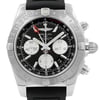 An image of a pre-owned Breitling men's wristwatch in good condition, shown in a front close-up view highlighting the watch face. The watch features a round stainless steel case, a black dial with stick indices and a seconds hand, and a gray bezel with a tachymeter on the inner bezel ring. The style is luxury with a rubber band, and the dial includes three subdials. The angle of the shot is head-on, providing a clear view of the watch details, and the distance is close enough to see the textures and inscriptions on the dial and bezel. The watch shows light signs of wear or scratches.