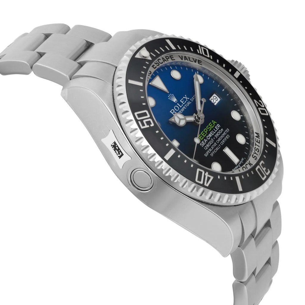 An image of a wristwatch shown from a side profile view, opposite the crown. The watch is positioned slightly at an angle, highlighting its bezel and bracelet. The perspective is close, capturing the unworn condition of the watch. The details of the watch face and the side of the case are clearly visible.