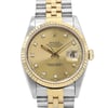 An image of a pre-owned men's Rolex wristwatch, featuring a two-tone metal band in stainless steel and gold. The watch face is gold with diamond hour markers and a date indicator at the 3 o'clock position. The image is taken from a front angle at a close distance, highlighting the details of the watch face and the band.