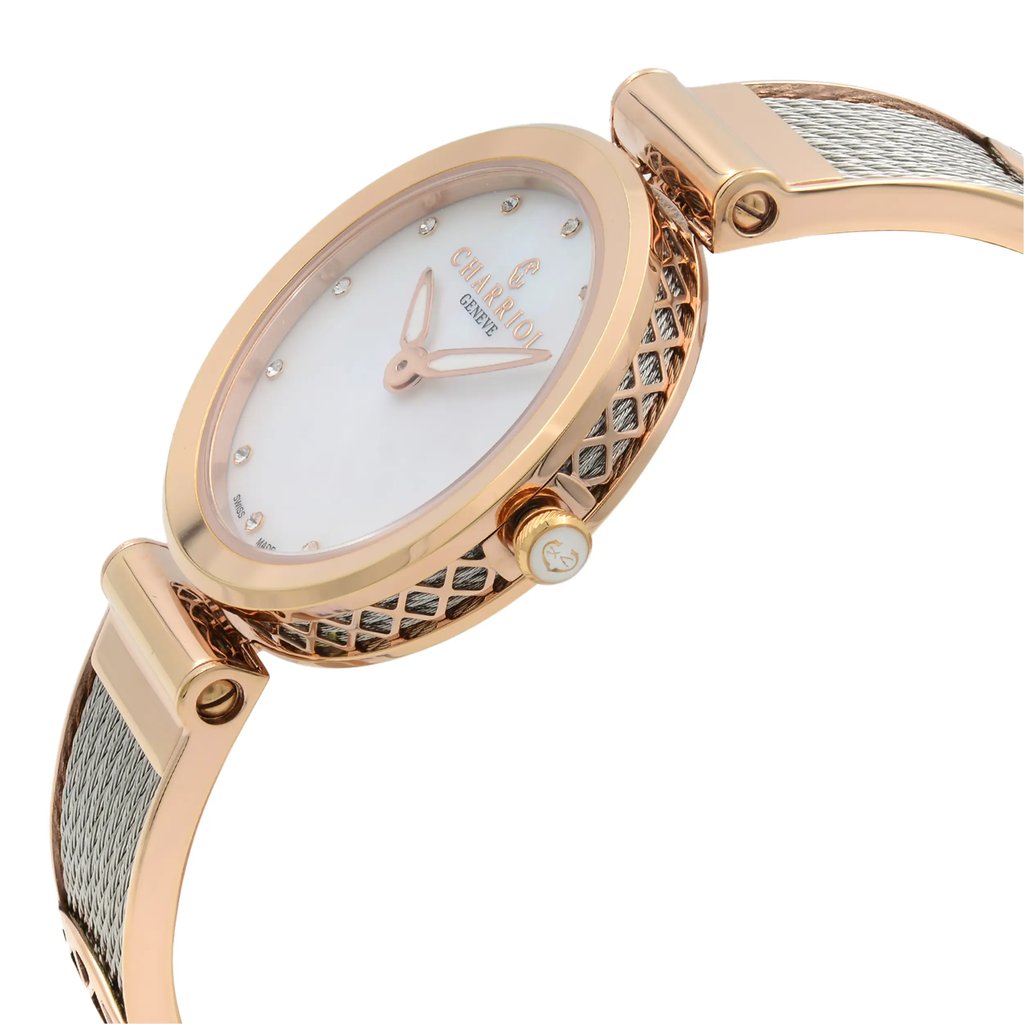 An image of a pre-owned wristwatch, shown from a side profile view with the crown clearly visible. The watch features a round face with a rose-gold tone bezel and a mesh strap. The angle highlights the intricate detailing on the side of the watch case and the crown. The photograph is taken at a close distance, emphasizing the watch's design and craftsmanship.
