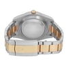 An image of a pre-owned Rolex men's wristwatch viewed from the back, showing the screwback case and the closed fold-over clasp. The watch is shot from a direct angle at a close distance, highlighting the contrasting stainless steel and solid gold band materials. The round caseback appears in the center with light signs of wear and scratches. The brand logo is subtly visible on the clasp.
