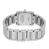 An image of a pre-owned Cartier women's wristwatch, positioned facing away from the viewer to display the back of the watch case and bracelet. The angle is slightly elevated, capturing the entire stainless steel bracelet in a semi-circle. The distance is close, highlighting the inscriptions and details on the watch's back.
