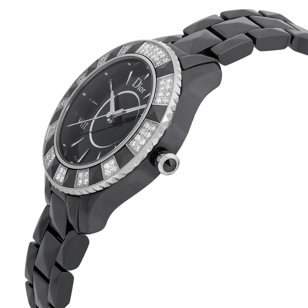 An image of a wristwatch displayed in a side profile view, showcasing the crown prominently. The watch features a dark, glossy bracelet and a bezel adorned with alternating segments of black and diamond-like stones. The watch face is black with silver-tone markers and hands, and the brand name is visible. The angle emphasizes the watch's sleek design and luxurious detailing, capturing it from a close distance.