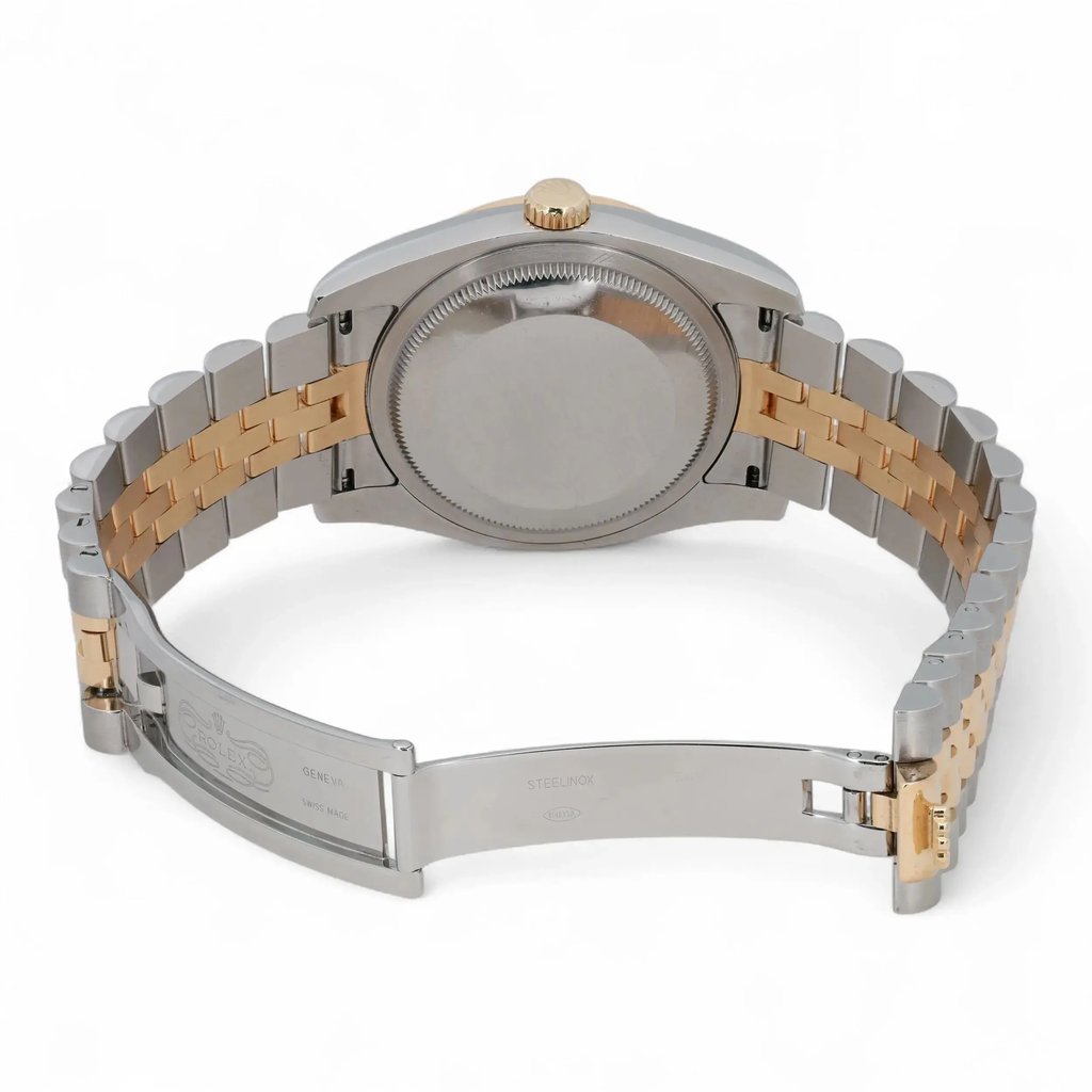 An image of a pre-owned Rolex unisex wristwatch, viewed from the back at a slight angle. The focus is on the stainless steel and gold-toned bracelet, which is open to show the clasp. The watch case is centrally positioned, and the crown is visible at the top, with the date indicator feature noted. The image is taken from a close distance, highlighting the details of the bracelet links and clasp engravings.