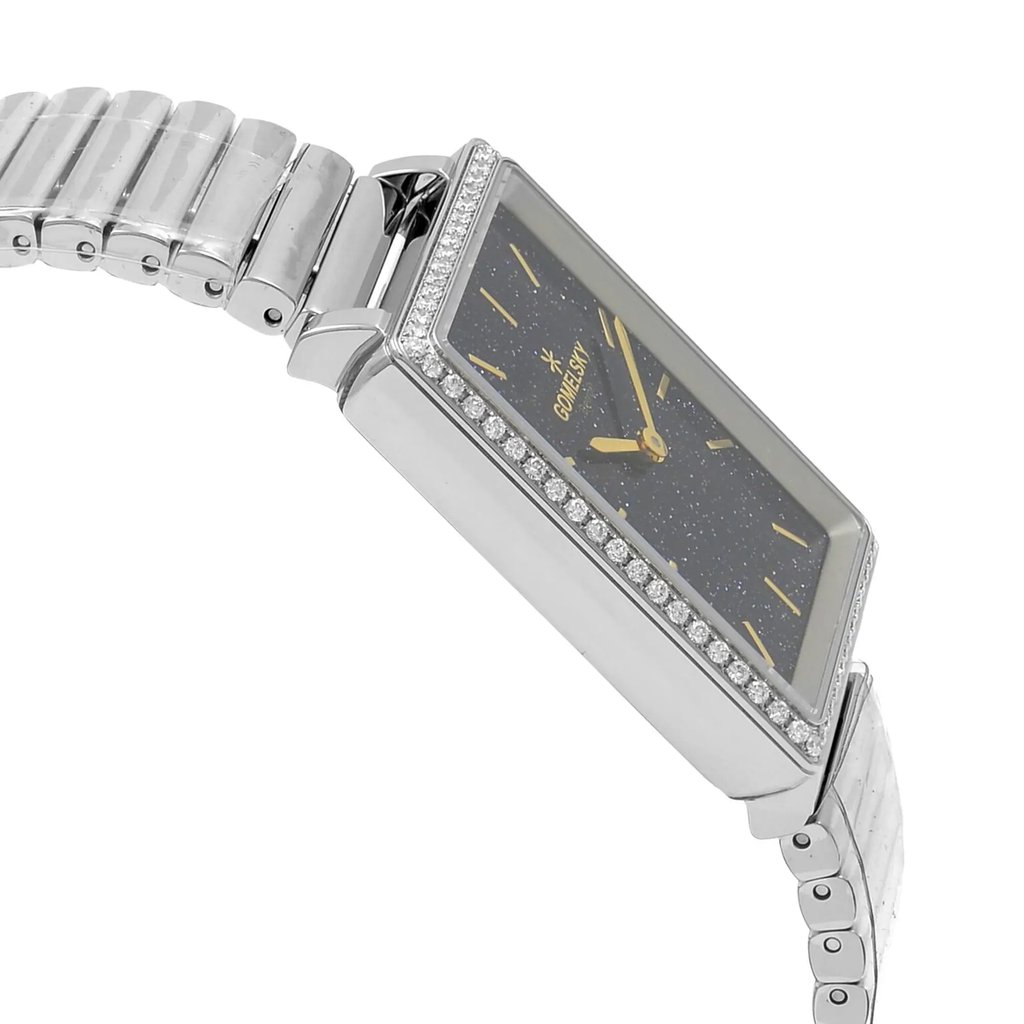 An image of a wristwatch viewed from the side profile, opposite the crown. The watch is unworn, showcasing a sleek, rectangular face with a sparkling bezel. The dial is dark with gold hands and markers. The bracelet is metallic, consisting of polished, linked segments. The angle highlights the watch's elegant design and craftsmanship.