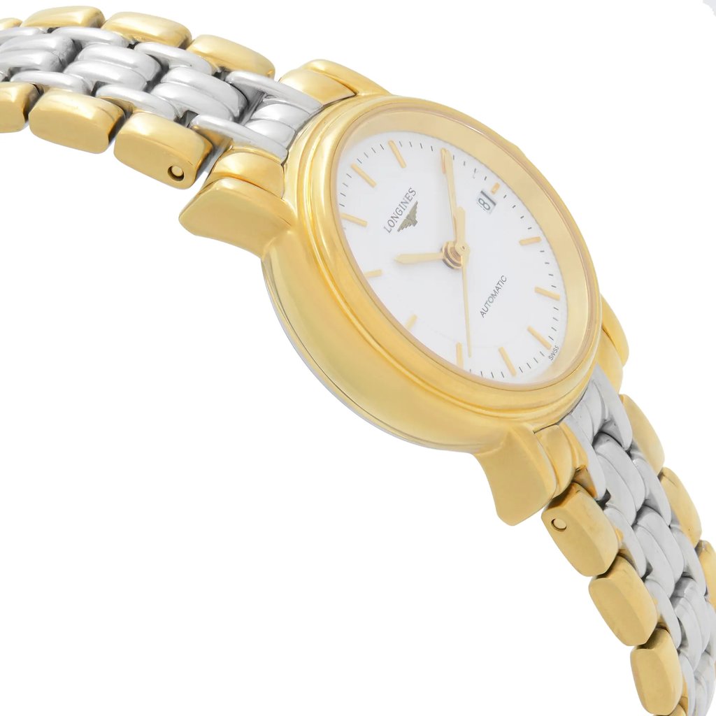 An image of a wristwatch displayed in a side profile view, opposite the crown. The watch features a gold-tone bezel and a two-tone metal bracelet in gold and silver. The face is white with gold hour markers and hands, and a date window is visible. The watch is positioned at an angle, showcasing its sleek design and the shine of the metal, photographed at a close distance.