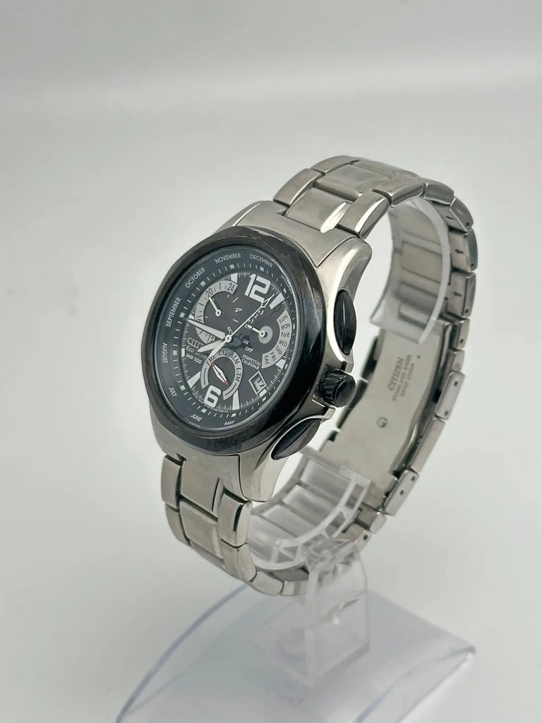 An image of a Wristwatch by Citizen. This Pre Owned item is designed for Men, featuring a Casual style. It has a Quartz movement and an Analog display with a Brown dial color. The indices include 12-Hour Dial,Arabic Numerals,Stick Indexes. The band is made of nan and the case is made of nan. The watch has a Round shape with a case size of 42 mm and a case thickness of 11 mm.