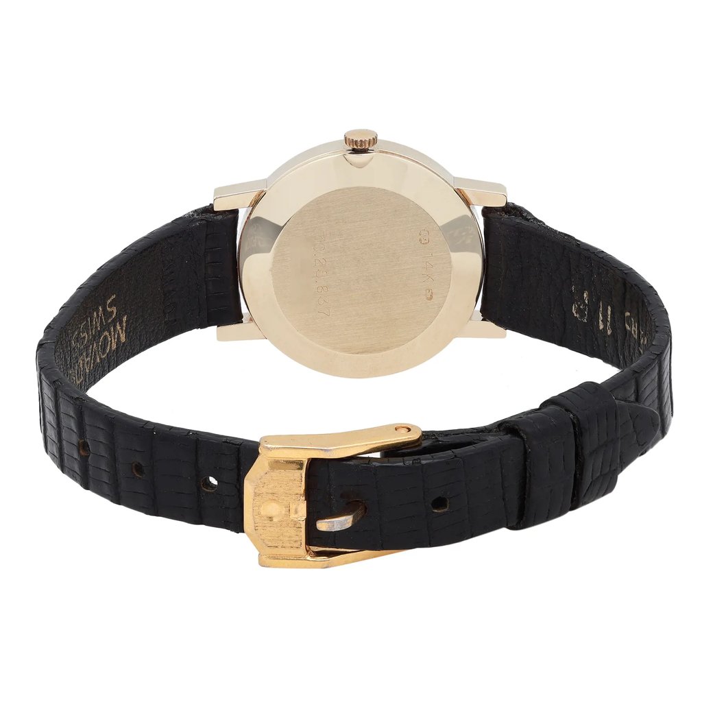 An image of a Wristwatch by Movado. This Pre Owned item is designed for Women, featuring a Classic style. It has a Quartz movement and an Analog display with a Black dial color. The indices include No Hour Marks. The band is made of Leather and the case is made of Yellow Gold. The watch has a Round shape with a case size of 22 mm and a case thickness of 5 mm.