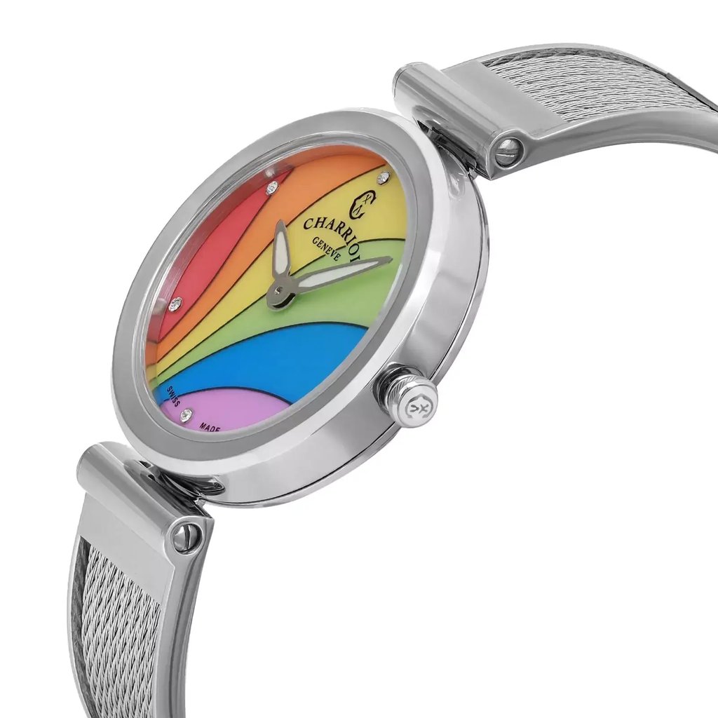 An image of a wristwatch displayed in a side profile view, showcasing the crown prominently. The watch features a colorful face with a rainbow design, housed in a sleek silver case. The mesh band is visible, adding to the elegant appearance. The angle highlights the watch’s design details from a close distance, emphasizing its vibrant and modern aesthetic.