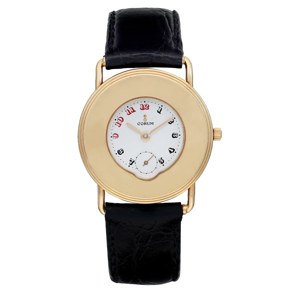 An image of a pre-owned wristwatch with a front full frontal view. The watch features a round gold case and a white dial with red and black Arabic numerals. It has a simple black leather strap. The crown is positioned on the right side of the case.
