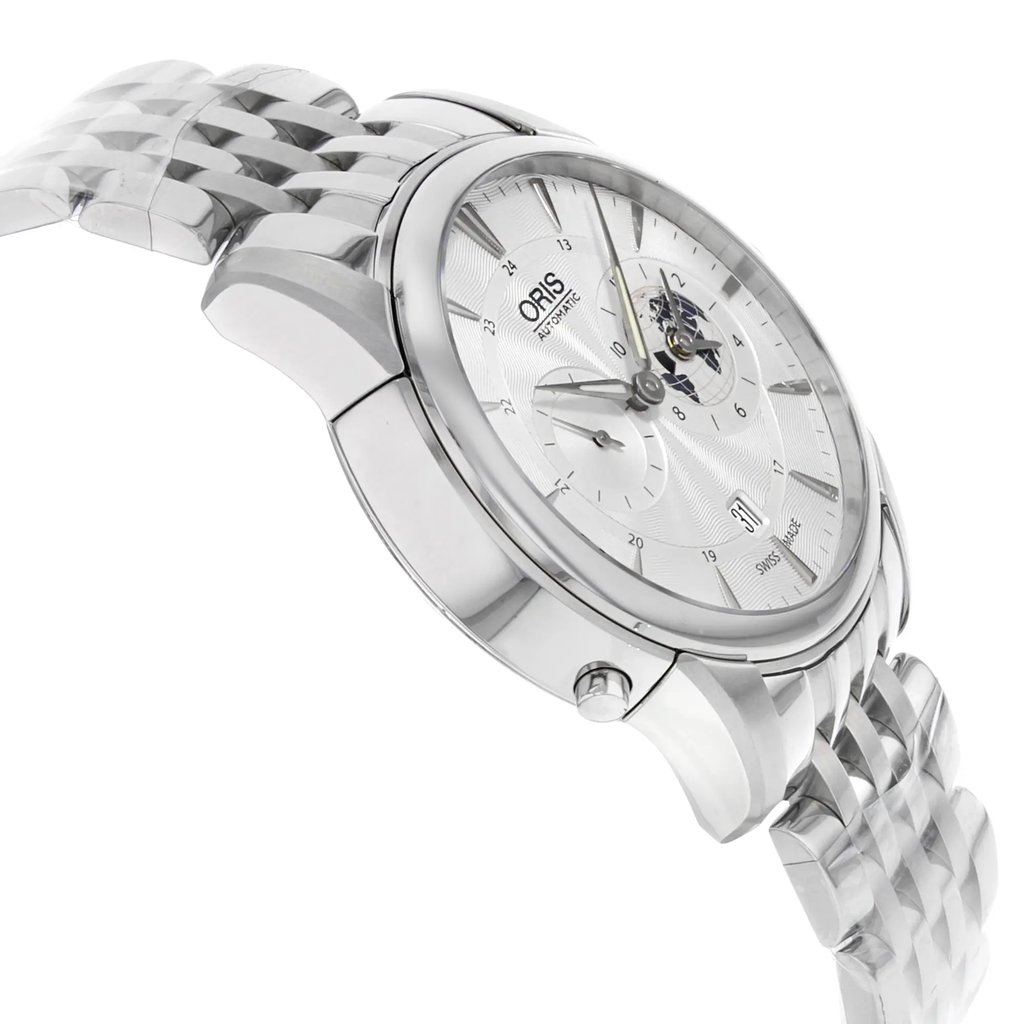An image of a wristwatch taken from a side profile view, opposite the crown, showcasing its sleek design. The angle captures the watch at a slight tilt, highlighting the intricate details of its silver dial and the polished metal bracelet. The display model is positioned closely, emphasizing its elegant craftsmanship and sophisticated finish.