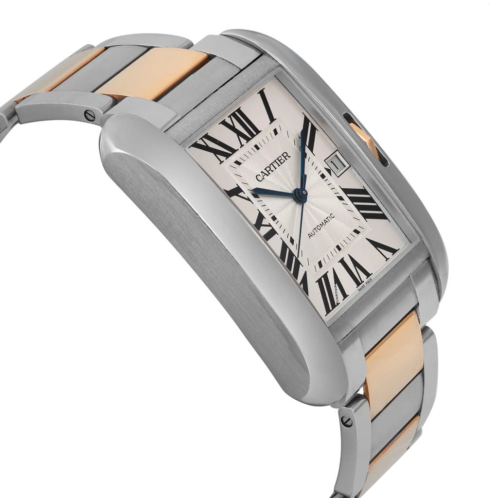 An image of a pre-owned women's Cartier wristwatch viewed from a close-up angle. The watch displays a date indicator and features a rectangular face with Roman numerals. It has a two-tone metal bracelet, combining steel and gold hues. The photograph captures the watch at a slight diagonal, emphasizing its elegant design and craftsmanship.