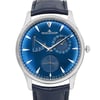 An image of a pre-owned wristwatch featuring a front close-up shot of the watch face. The watch has a blue dial with silver hour markers and hands. It includes a power reserve indicator and a date subdial. The watch case is silver, and the strap is dark leather. The brand name is displayed prominently below the 12 o'clock position.