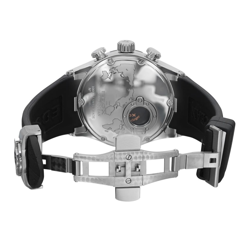 An image of an unworn Edox men's wristwatch featuring a round stainless steel case with an exhibition caseback displaying an intricate design and brand markings. The watch is shown from the back view with the clasp open, positioned at a straight angle to the camera at a close distance. The black rubber band is stretched out on either side, highlighting the fold-over clasp with double push-button release. The watch's construction emphasizes its high-quality material and craftsmanship.