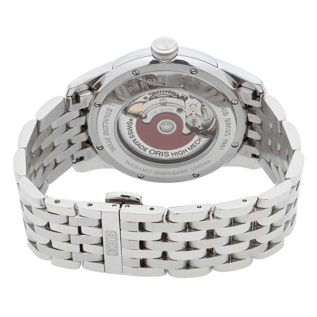 An image of a pre-owned wristwatch viewed from the back, showcasing the intricate movement through the transparent case back. The watch is positioned at a slight angle, highlighting the closed clasp on the stainless steel bracelet. The brand name "Oris" is visible on both the clasp and the movement. The image provides a close-up view, emphasizing the craftsmanship and detailing of the watch.