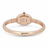 An image of a pre-owned Cartier women's wristwatch, viewed from a low rear angle. The focus is on the back of the watch case, showcasing engraved details. The watch is positioned at a slight angle, highlighting its elegant rose gold bracelet. The image is taken at a close distance, emphasizing the craftsmanship and design of the timepiece.