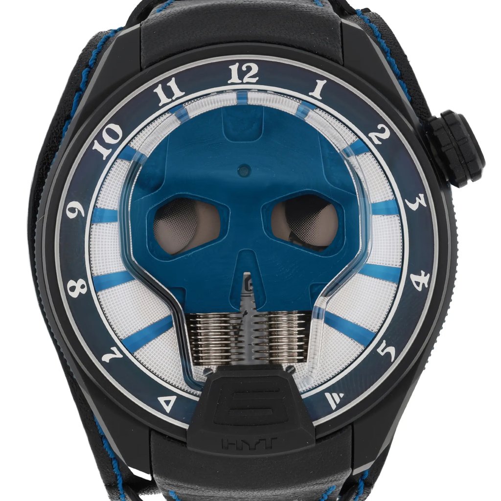 An image of a pre-owned HYT Skull AXL Guns N Roses 51mm Titanium PVD men's wristwatch taken from a front-facing angle at a close distance. The watch features a prominent skull design on the BLUE dial, with blue accents and hour markers around the edge. The strap is black with blue stitching, and the crown is positioned on the right side.