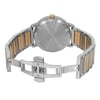 An image of a pre-owned wristwatch taken from the back view at a close distance. The watch's clasp is open, revealing a two-tone metal bracelet with alternating silver and gold links. The case back is round and metallic, with engraved text. The angle shows the watch lying flat with the open clasp facing forward, highlighting the details of the bracelet and clasp mechanism.