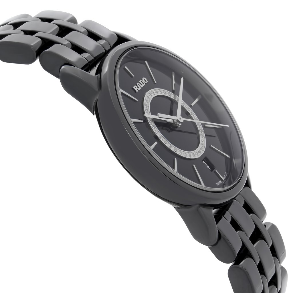 An image of a wristwatch taken from a side profile view, opposite the crown. The watch has a sleek, glossy finish with a linked bracelet and a dark dial. This close-up angle highlights the watch's new condition, despite being labeled "new with defects." The brand name is visible on the dial.