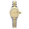 An image of a pre-owned women's Rolex Datejust 26mm Gold Steel Diamond Champagne Dial Ladies Watch 69173, viewed from the front at a straight-on angle. The watch features a two-tone design with a stainless steel and gold bracelet. The dial is gold with diamond hour markers and includes a date indicator at the 3 o'clock position. The image captures the watch in close-up detail, highlighting its elegant design and craftsmanship.