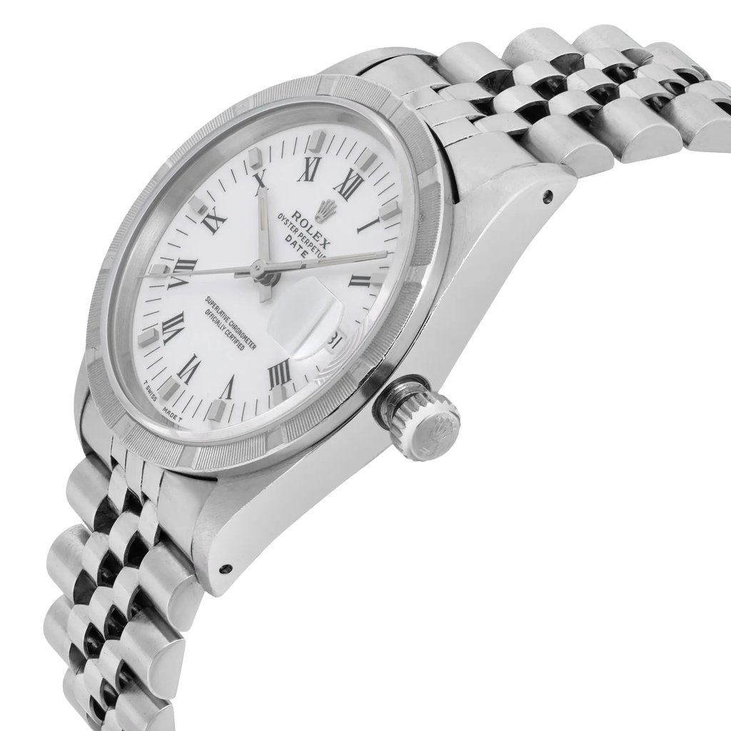An image of a pre-owned Rolex wristwatch taken from a slightly elevated angle, showcasing the right side. The watch features a white dial with Roman numerals, a date indicator, and luminous hands. The stainless steel bracelet is partially visible, with the crown clearly in view.