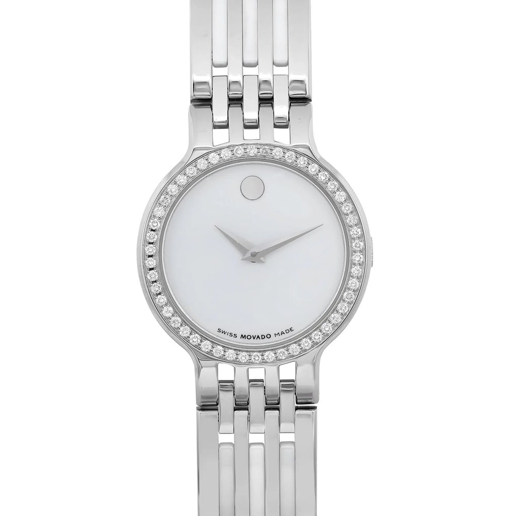 An image of a pre-owned women's Movado wristwatch, shown from a front close-up angle. The watch features a round, white dial with no hour marks, encased in a stainless steel case with a gray bezel. The band is made of ceramic and stainless steel. The watch is in good condition with a casual style.