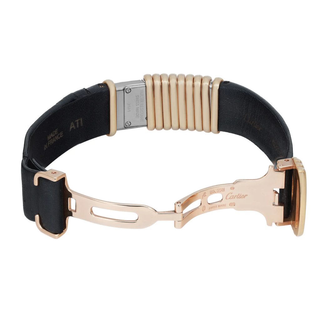 An image of a pre-owned wristwatch viewed from the back, showcasing an open clasp. The watch features a gold-toned clasp with engraved details, and a black band. The image is taken from a close distance, highlighting the intricate design and materials used in the clasp mechanism.