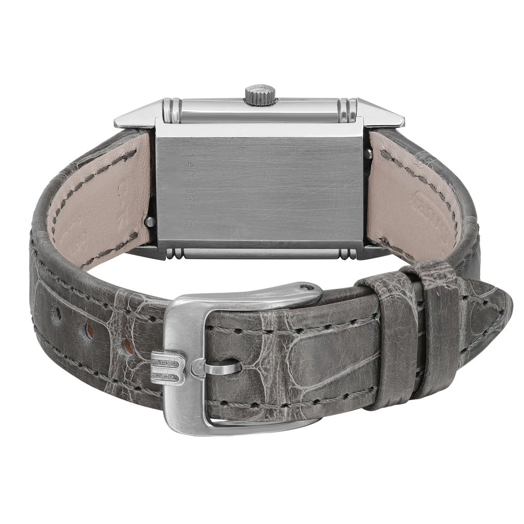 An image of a Wristwatch by Jaeger-LeCoultre. This Pre Owned item is designed for Women, featuring a Casual style. It has a Quartz movement and an Analog display with a White dial color. The indices include 12-Hour Dial,Arabic Numerals. The band is made of Leather and the case is made of Stainless Steel. The watch has a Rectangle shape with a case size of 27 X 19 mm and a case thickness of 7 mm.