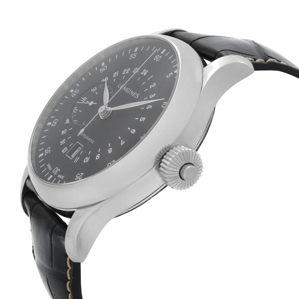 An image of a wristwatch in a side profile view, showcasing the crown prominently. The watch features a sleek, polished metal case with a black dial and silver markers. The black leather strap is visible, adding to the watch's elegant appearance. The angle highlights the texture of the crown and the contours of the case, giving a detailed view of the display model.