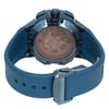 An image of a pre-owned wristwatch viewed from the back, showcasing the closed clasp. The watch is positioned at a slight angle, allowing a clear view of the intricate mechanical details through the transparent case back. The blue strap with a honeycomb pattern and metallic clasp is prominently displayed in the foreground. The brand name is visible on the clasp, adding to the detailed presentation of the watch's features.