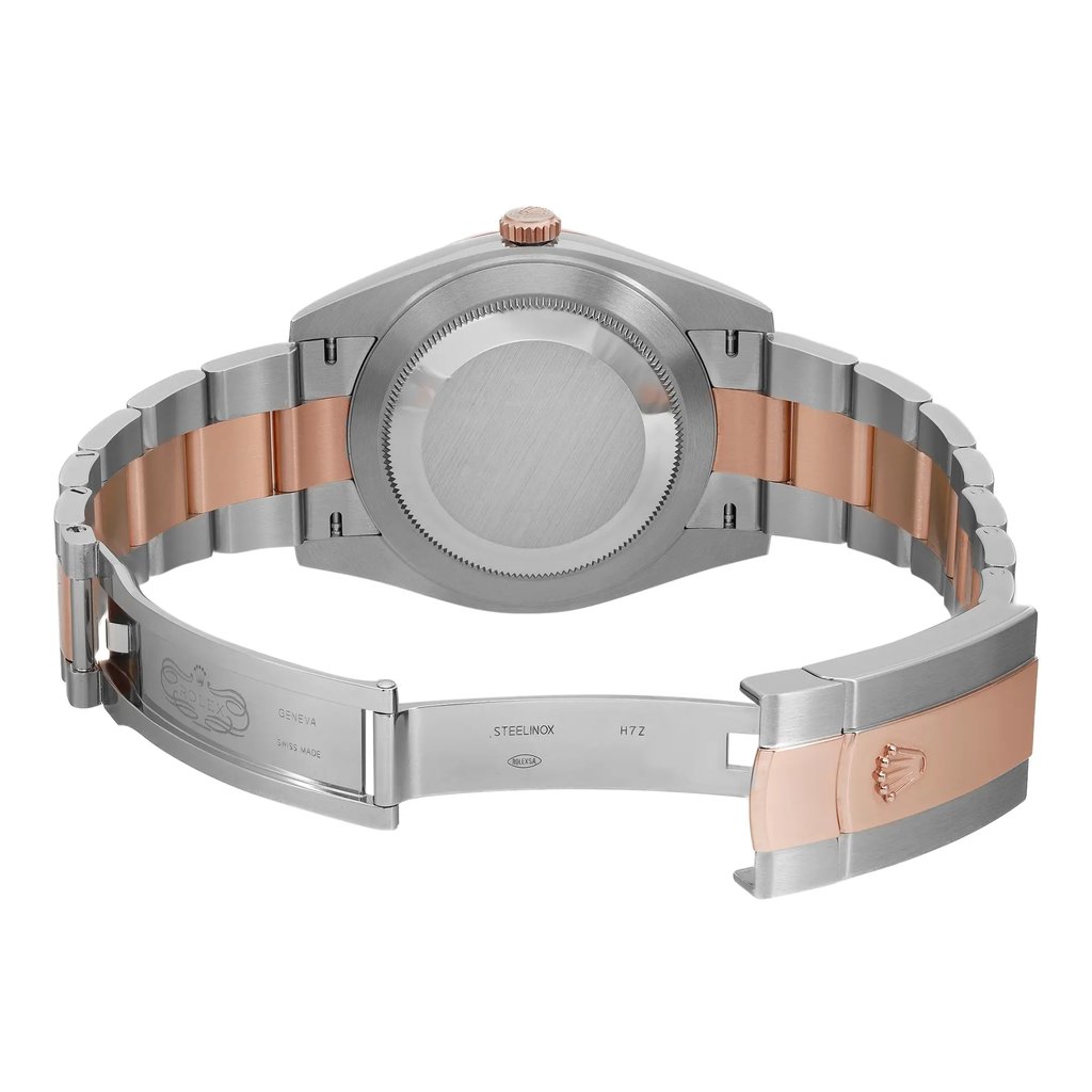An image of a men's Rolex wristwatch in a display model condition, positioned centrally with a back view and an open clasp. The watch features a round stainless steel case with a screwback, and a band that combines stainless steel with rose gold elements. The closure is a fold-over clasp, visible and partially extended in the middle of the frame. The watch is captured from a direct rear angle at a close distance, highlighting the craftsmanship and materials of the band and caseback.